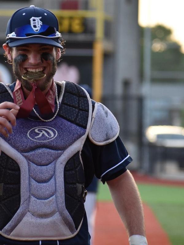 Baseball catcher with medal